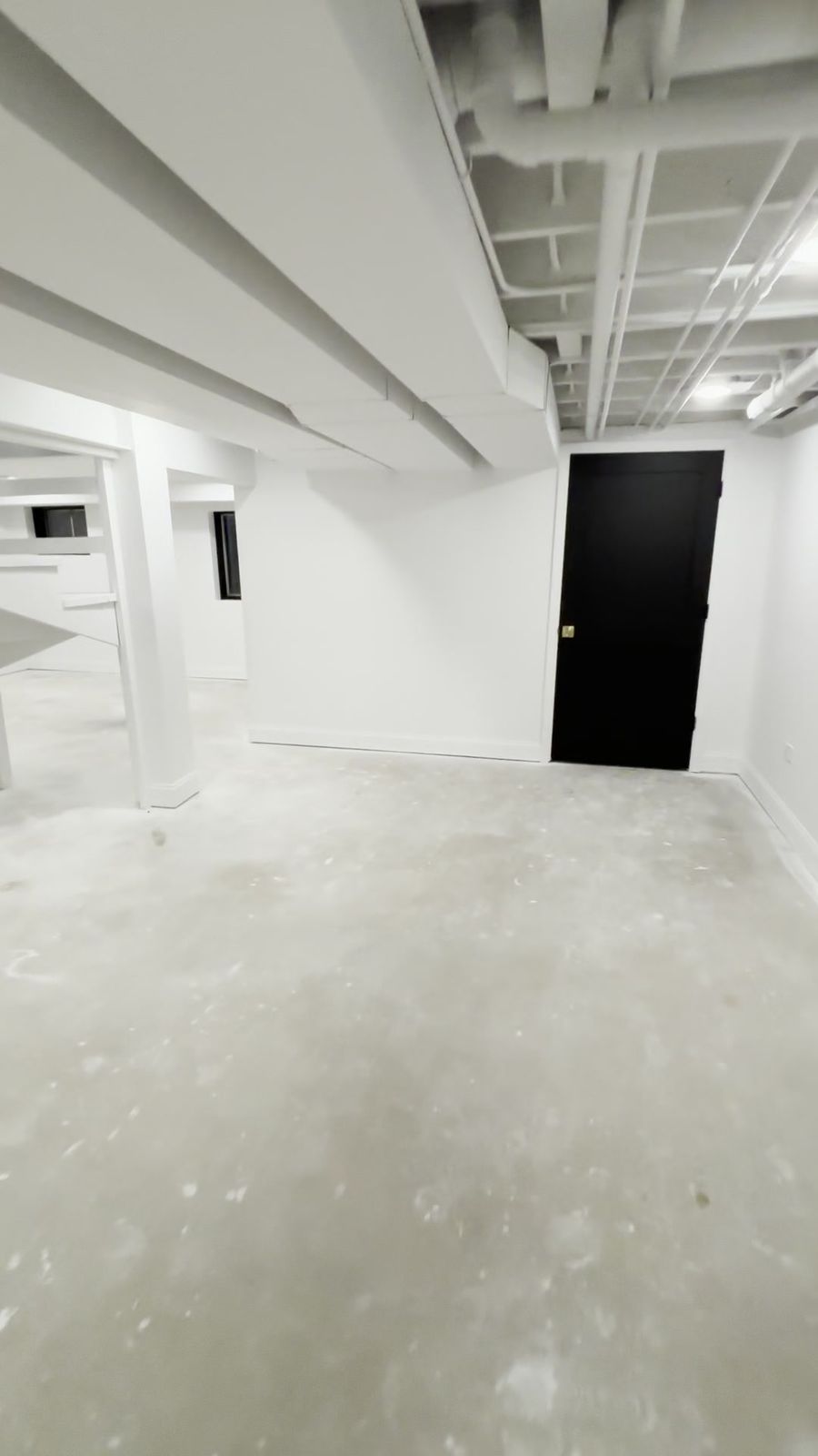 Finished open living space with recessed lighting