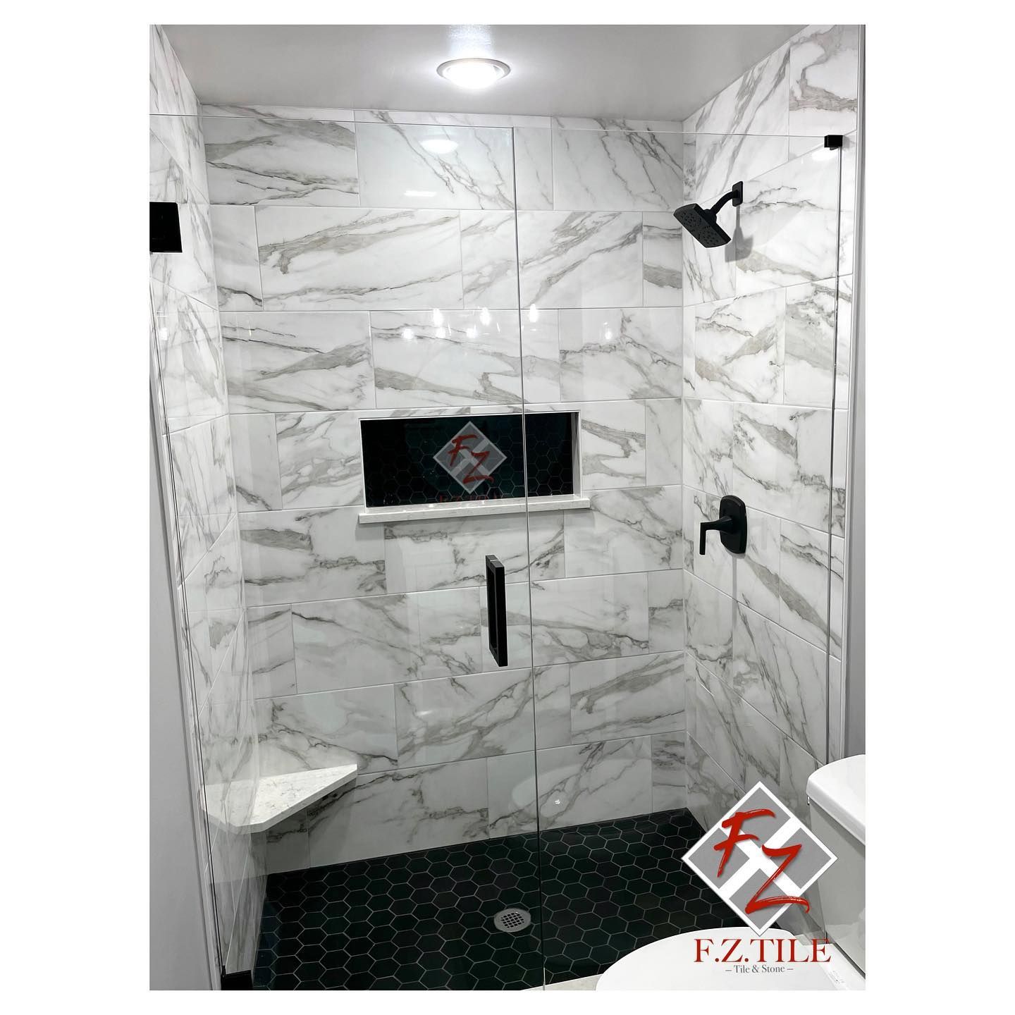 Calacatta walk-in with black hex floor