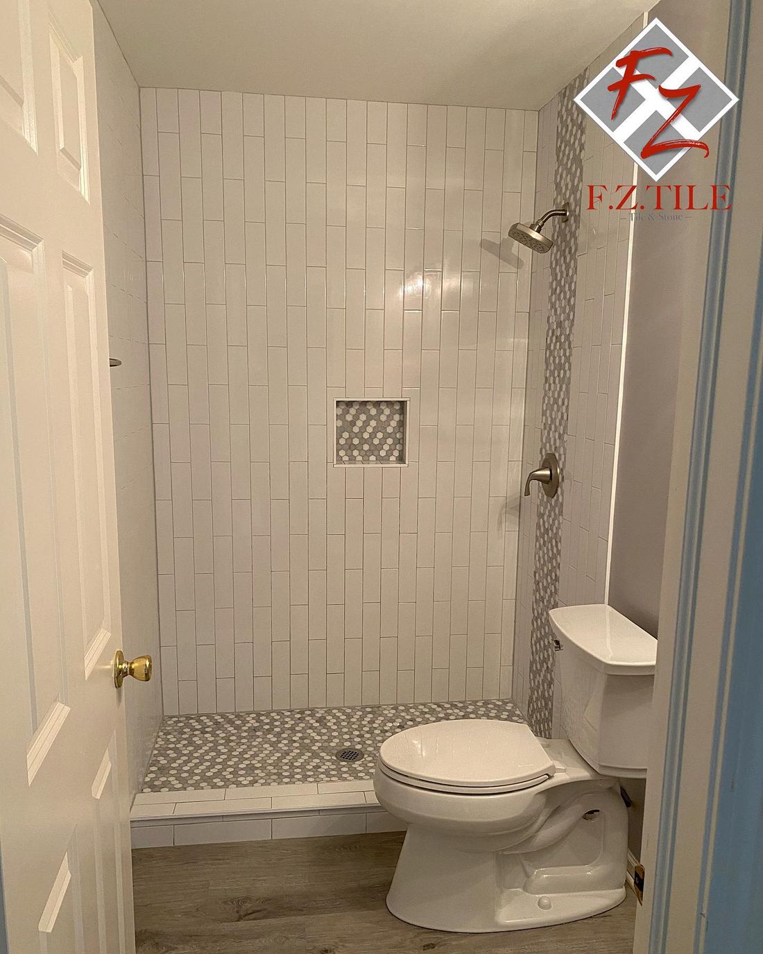 Finished subway tile shower with recessed niche