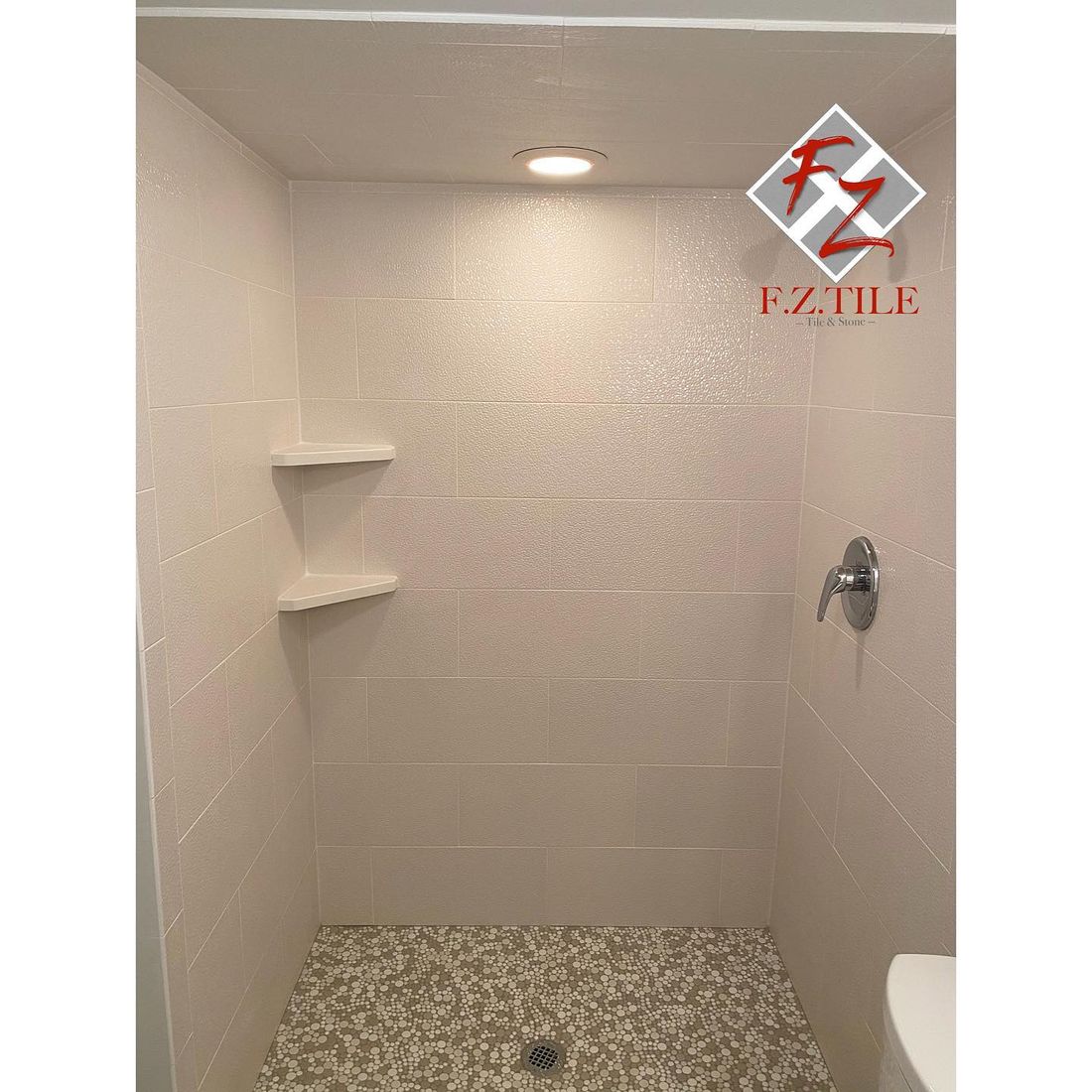 Large-format low-grout shower